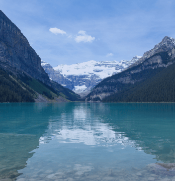 Iconic view of Lake Louise in Alberta, Canada, featuring the Rocky Mountains in the background.